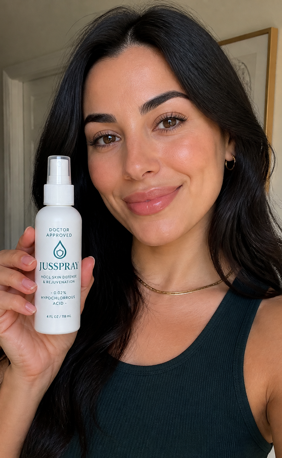 Dark-haired customer holding the JusSpray bottle up to camera