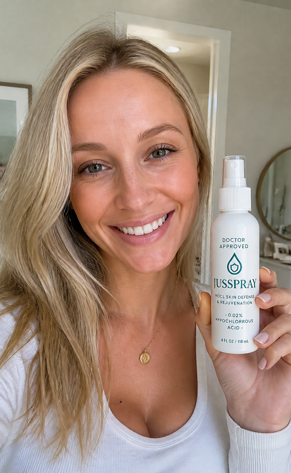 Blonde customer smiling while holding the JusSpray bottle